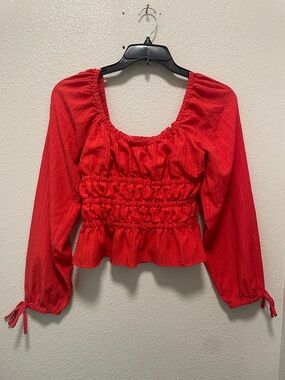 Red Better Unsaid blouse with tie sleeves. Size L